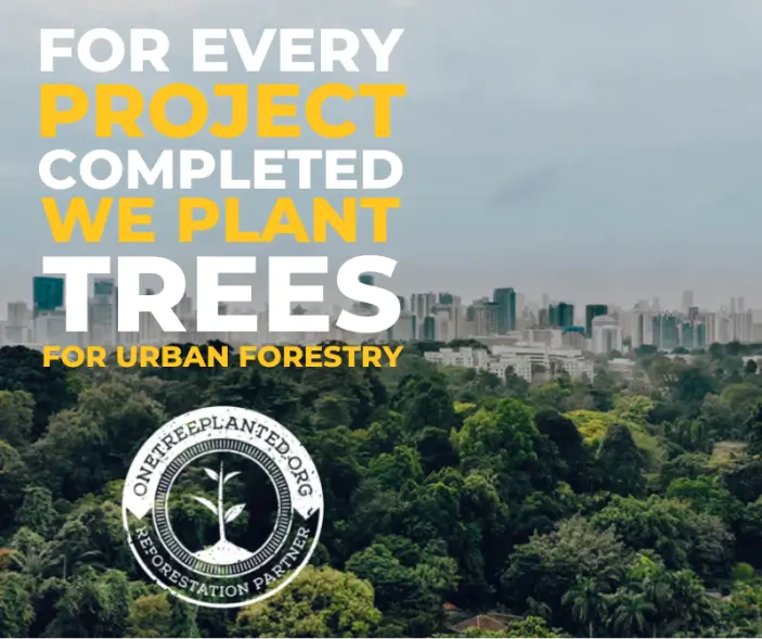 Promotional image stating 'For every project completed, we plant trees for urban forestry,' with the One Tree Planted reforestation partner logo and a city skyline in the background with dense forest in the foreground.