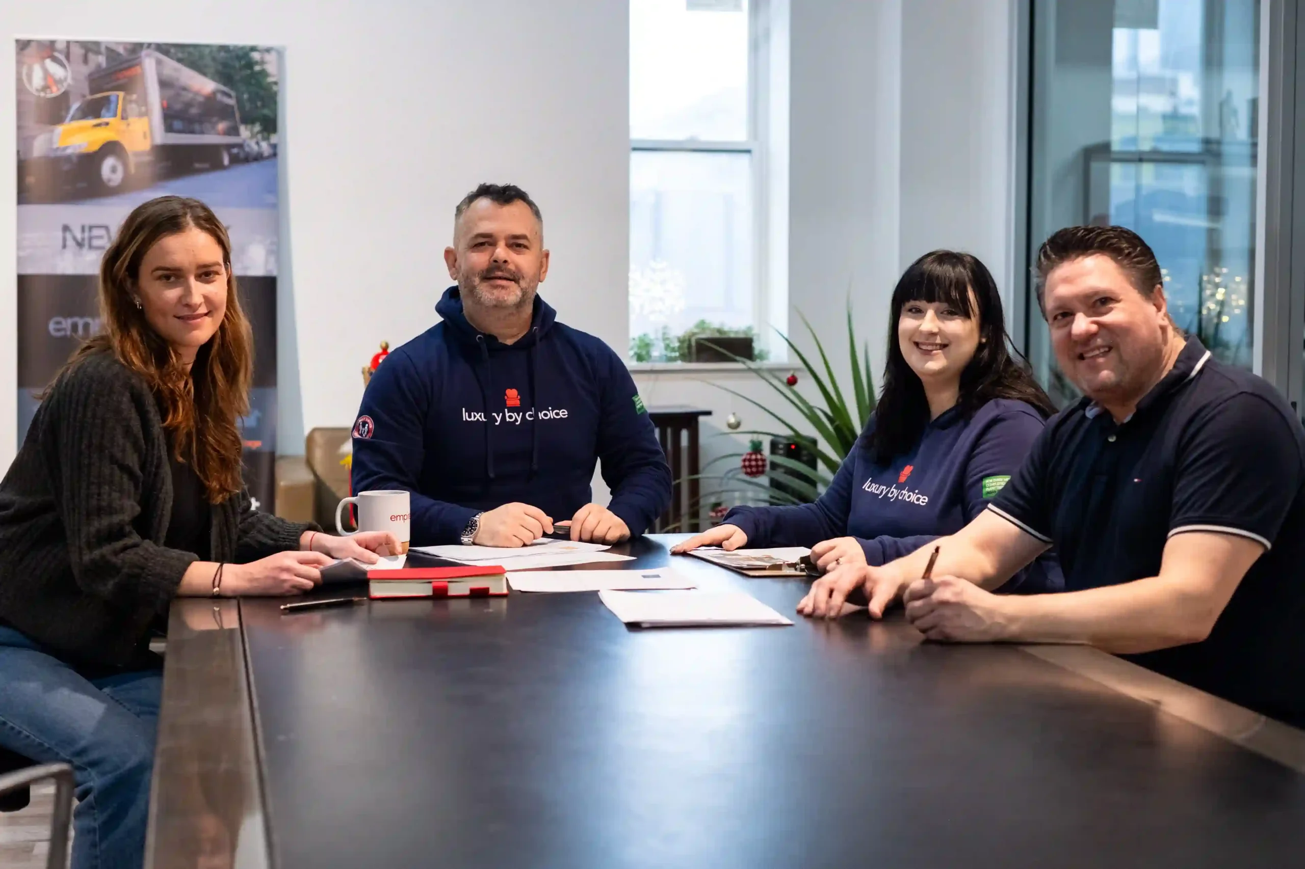 Board members of Empire Movers and Storage at a meeting table in the NYC HQ
