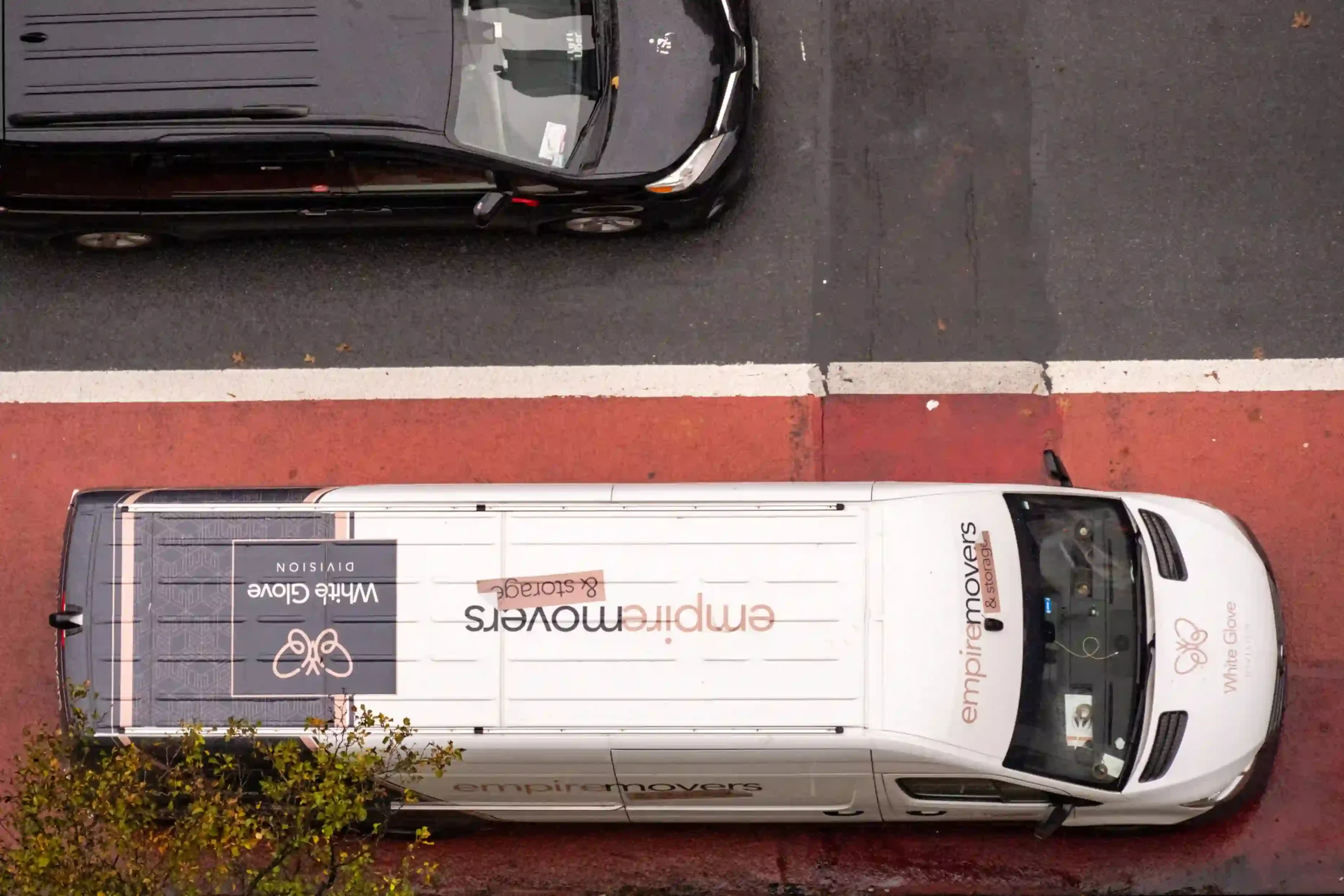 White glove moving division truck of Empire Movers and Storage on New York city street.