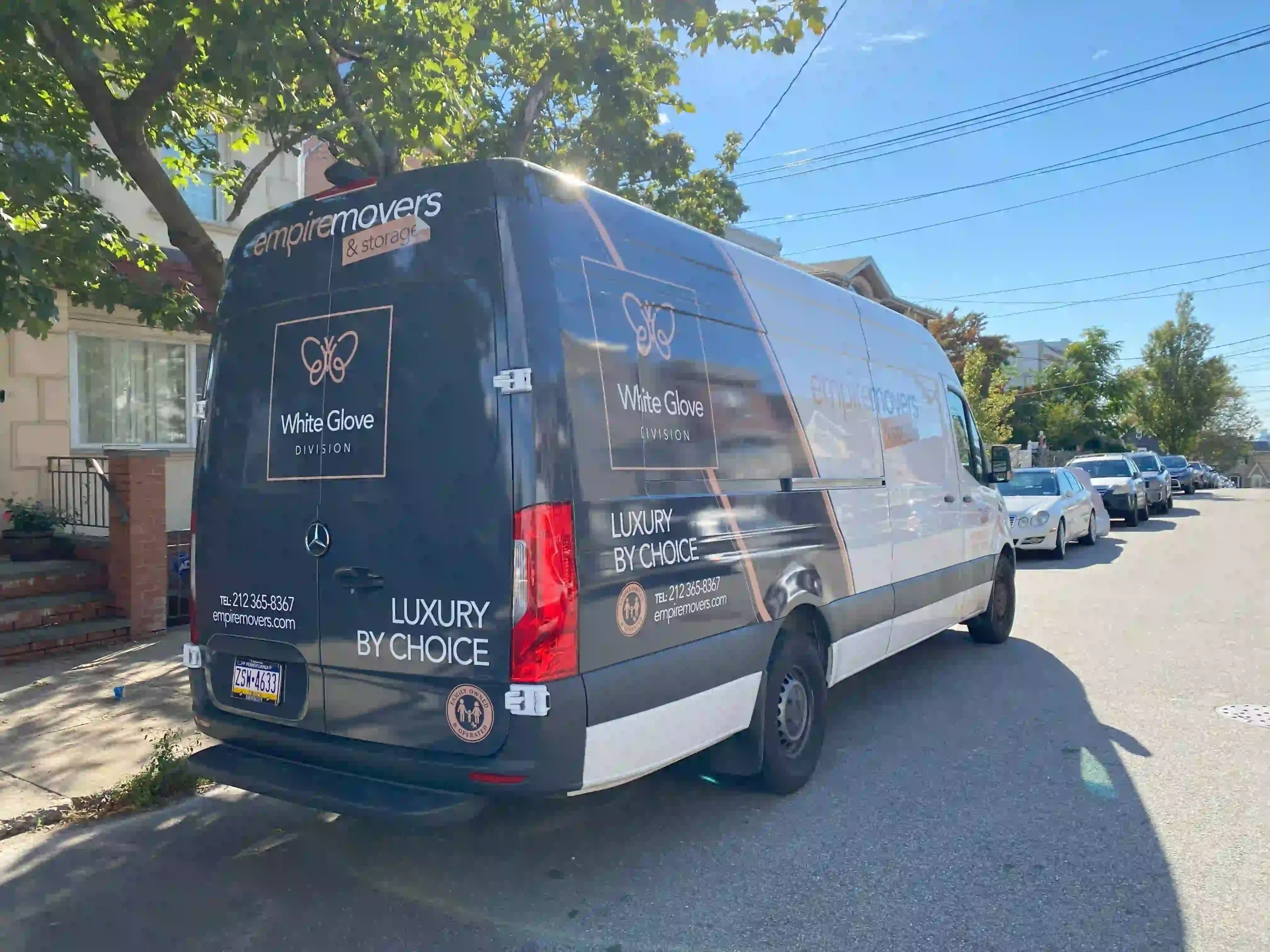 White glove moving division truck of Empire Movers and Storage parked on NYC street