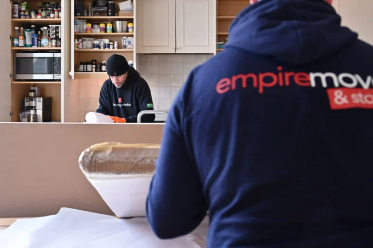 Staten Island Movers NYC. Professional movers from Empire Movers and Storage NYC carefully preparing kitchen appliances for safe transport during a residential move